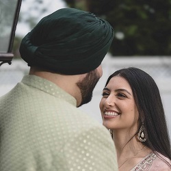 The Glorious Memories | Pre Wedding Photography in New Hyde Park, NY Smiling couple in traditional attire looking at each other during a pre wedding photography session.